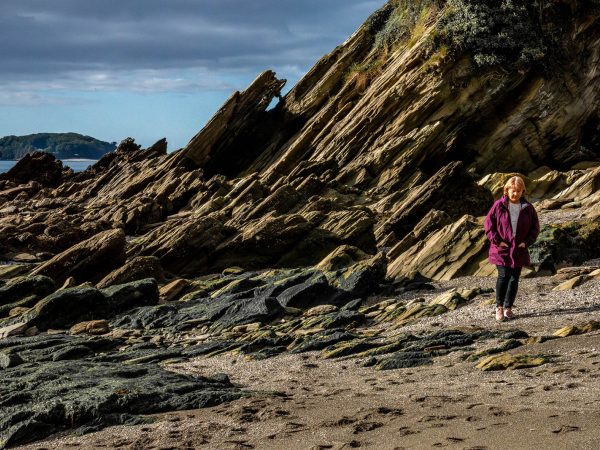 Niki walking on Millendreath Beach, Cornwall, PL13