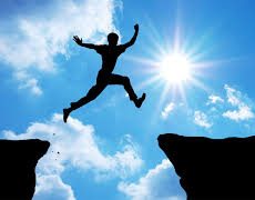 image of person leaping with sun in background